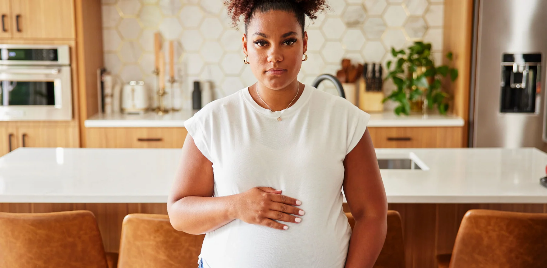 Pregnant Woman holding stomach